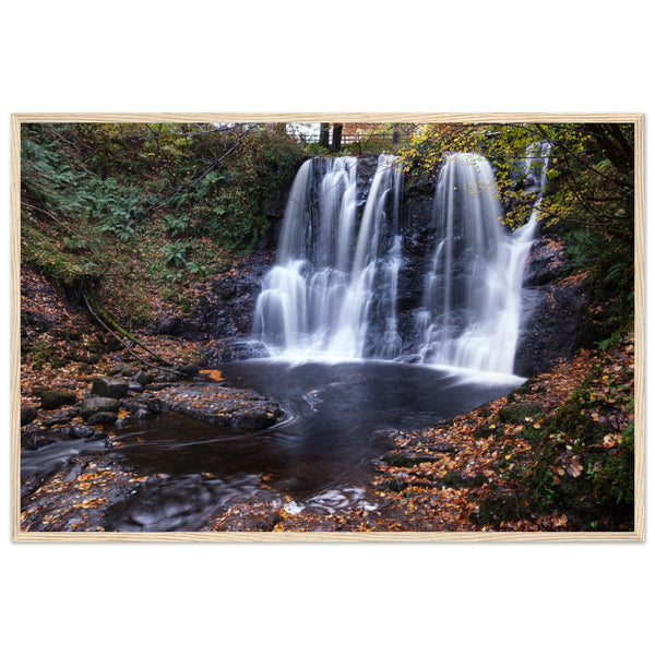 Framed print of Glenariff Waterfall, capturing the serene beauty of cascading water amidst lush greenery in the Glens of Antrim, Northern Ireland. Known as the 'Queen of the Glens,' this stunning landscape print brings nature's tranquility into your home.