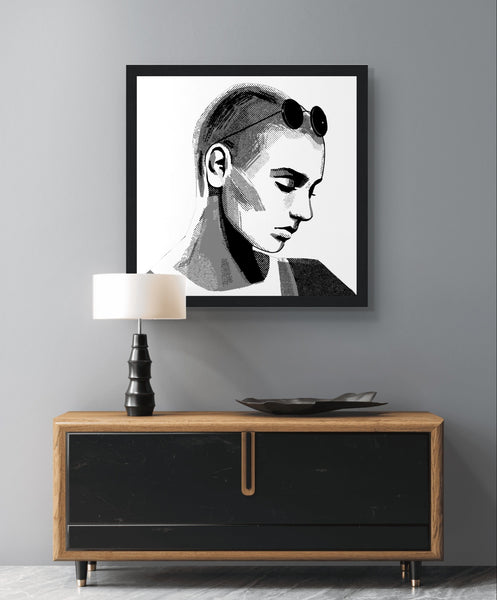 Framed wall art print of Sinéad O'Connor features a high-quality portrait capturing the iconic singer's striking presence, wearing sunglasses. This vintage music framed wall art showcases the Irish pop star, perfect for retro posters and prints. Ideal for fans of musician prints and Irish princess decor.