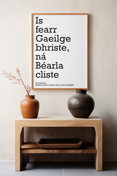 Art print with the Irish proverb Is fearr Gaeilge bhriste, na Bearla cliste meaning Broken Irish is better than clever English. Features elegant typography on a minimalist background. Celebrates Gaelic culture, perfect for Irish language enthusiasts.