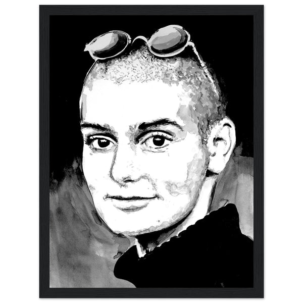 Framed wall art print of Sinéad O'Connor features a high-quality portrait capturing the iconic singer's striking presence. The detailed artwork, set in an elegant frame, highlights her expressive eyes and signature shaved head, adding a touch of music history to any decor.