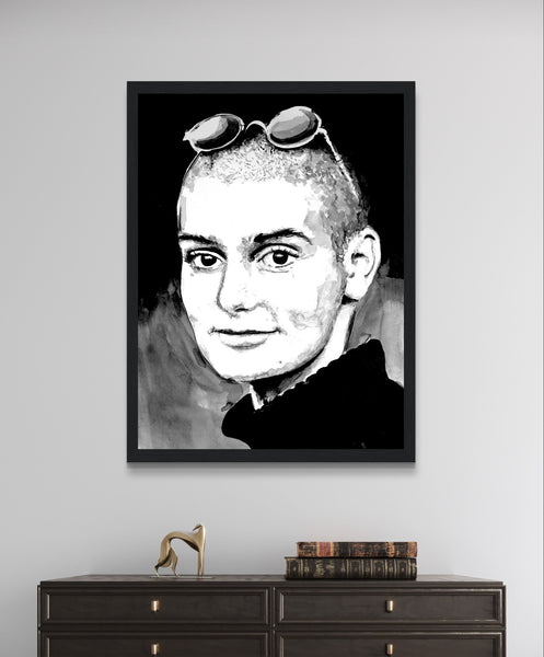 Framed wall art print of Sinéad O'Connor features a high-quality portrait capturing the iconic singer's striking presence. This vintage music framed wall art showcases the Irish pop star. Ideal for retro posters, musician prints, and fans of Ireland's Irish Princess.