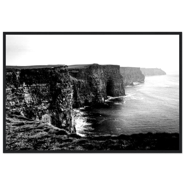 Monochrome photo of Cliffs of Moher, framed elegantly. Captures rugged beauty, contrasts. Minimalist frame complements decor. Evokes awe.