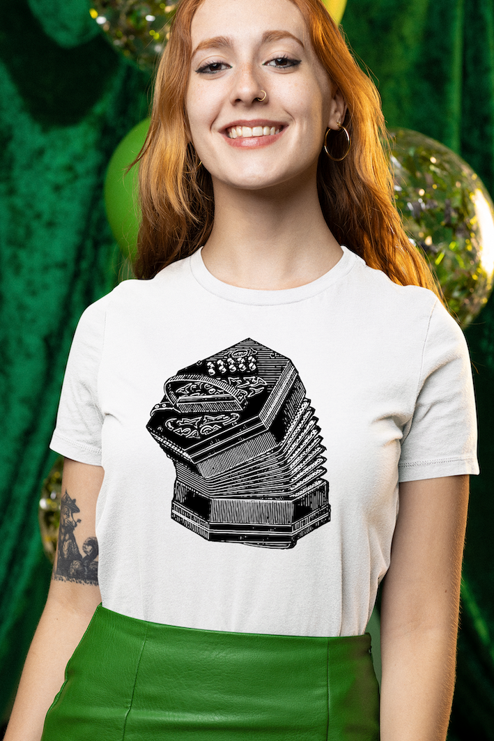 Redhead girl wearing a vintage unisex tee shirt with a black and white design of an old Irish concertina. Perfect for Celtic music lovers, folk instrument enthusiasts, and fans of Irish traditional music. Ideal music lover gift or musician apparel.