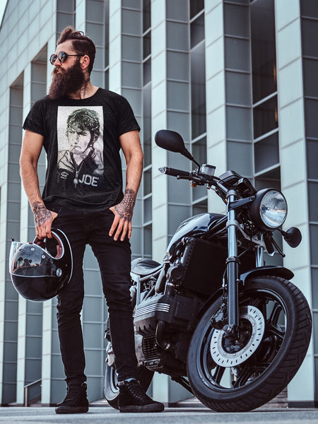 Unisex T-shirt celebrating Joey Dunlop, motorcycle racing legend. Features dynamic design highlighting Isle of Man TT, Ulster Grand Prix, North West 200. A must-have for fans. King of the Mountain